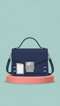 Blue crossbody satchel with geometric hardware